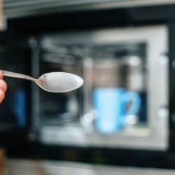 Close-up of a spoon by a microwave device, Can A Spoon Go In The Microwave?