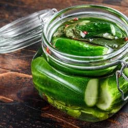 Green salted cucumbers in a glass jar, How To Brine Cucumbers For Pickles In 6 Easy Steps