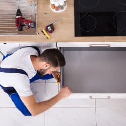 High Angle View Of Male Carpenter Fixing Drawer In Kitchen, Can You Buy Replacement Kitchen Drawers?