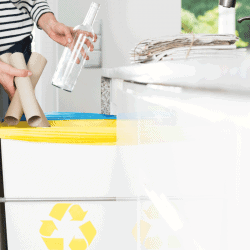 Housewife throwing paper into yellow bin. Segregation of garbage in the household. How To Empty A Trash Compactor And Clean It Properly