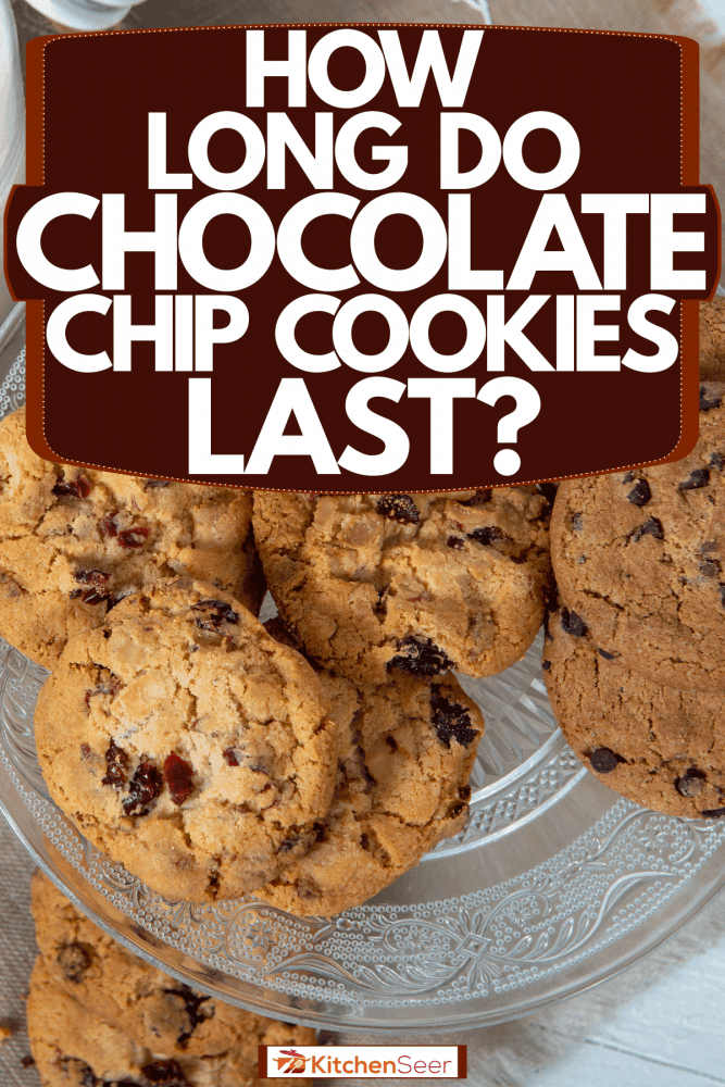 A glass bowl filled with chocolate chips and a jar of milk, How Long Do Chocolate Chip Cookies Last?