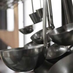 Ladles hanging inside a restaurant kitchen, What Size Should A Ladle Be?