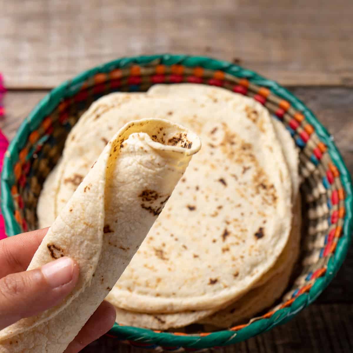 Mexican corn tortillas on wooden background
