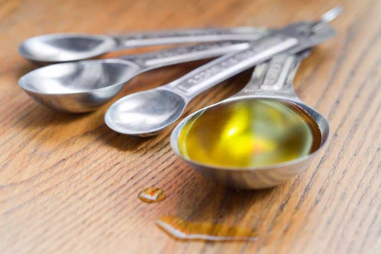 Olive oil in a measuring tablespoon, Spilled Cooking Oil On Kitchen Floor - How To Clean It Up