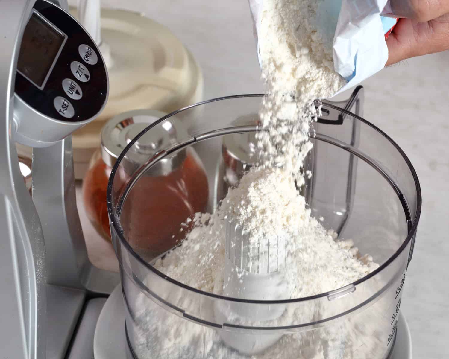 Pouring flour into mixer. Making Treacle Pie Series.