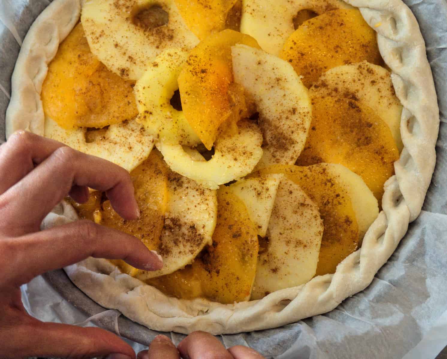 Preparation of apple persimmon pie at home. Homemade baking pastries with apples and persimmons