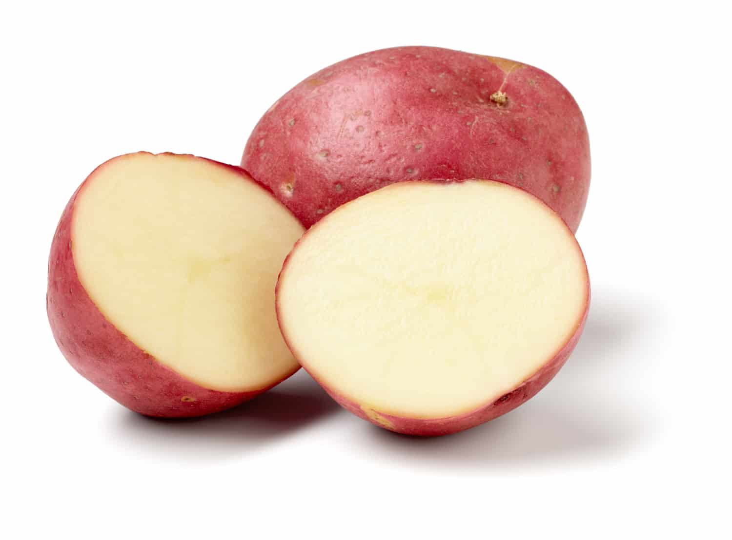 Red potatoes isolated on white background, larger files include clipping path. Color corrected, exported 16 bit depth,