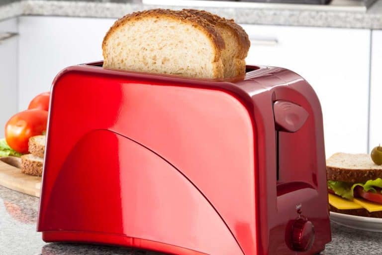 Red toaster on modern kitchen counter top, Do Toasters Have Capacitors?