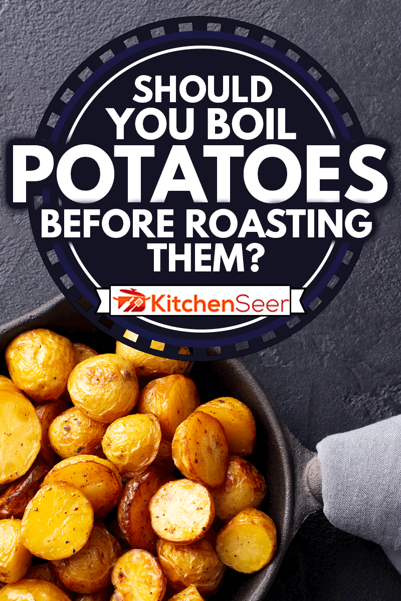 Roasted baby potatoes in iron skillet. Dark grey background, Should You Boil Potatoes Before Roasting Them?