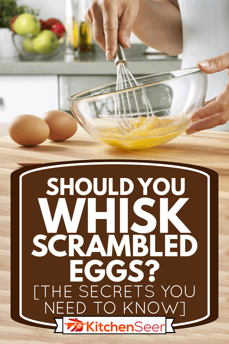A woman Preparing food in her home kitchen, whisking eggs, Should You Whisk Scrambled Eggs? [The Secrets You Need To Know!]