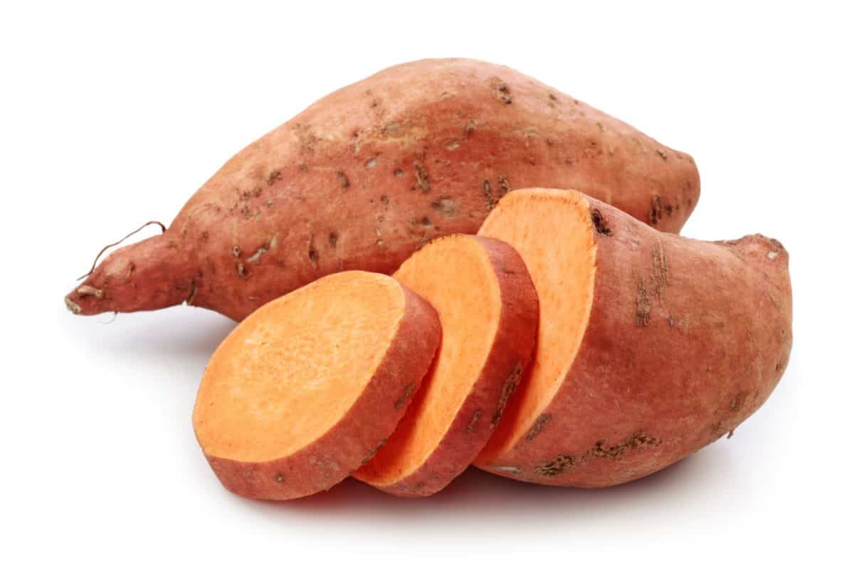 Sliced sweet potatoes on a white background
