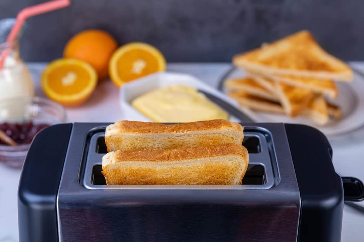 Slices of great toast coming out of the toaster