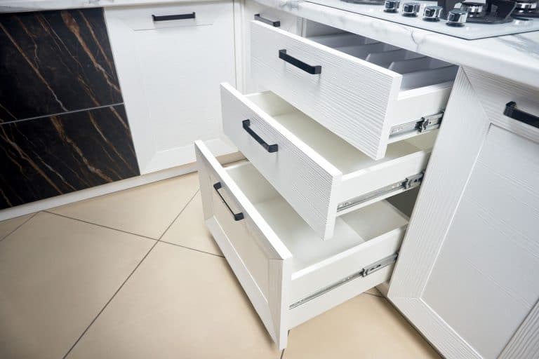 Three white kitchen drawers inside a white themed kitchen, Can Kitchen Drawers Be Converted To Soft Close?
