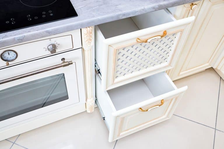 White kitchen drawers with a lattice design and golden handle, 7 Types Of Kitchen Drawers