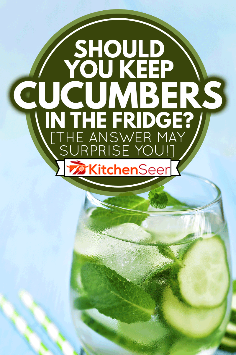 Homemade cucumber and mint lemonade in a glass on a blue wooden background, Should You Keep Cucumbers In The Fridge? [The Answer May Surprise You!]