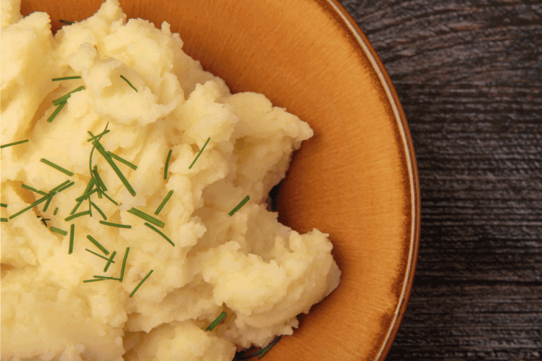bowl of mash potato topped with chives. How To Heat Up Mashed Potatoes