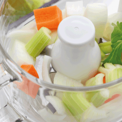 food processor with vegetable cuts inside ready for soup. Can You Blend Soup In A Food Processor