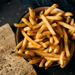 A bowl filled with fresh french fries, How Big Is A Serving Of French Fries? [And How Many Fries Are In One?]