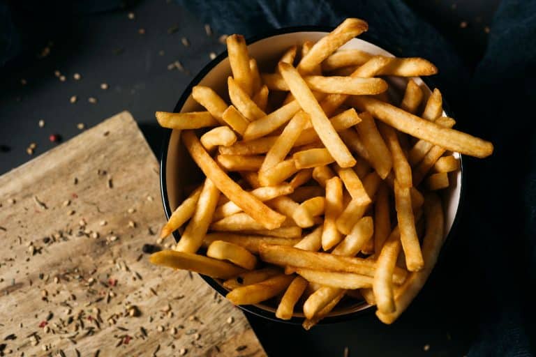 A bowl filled with fresh french fries, How Big Is A Serving Of French Fries? [And How Many Fries Are In One?]