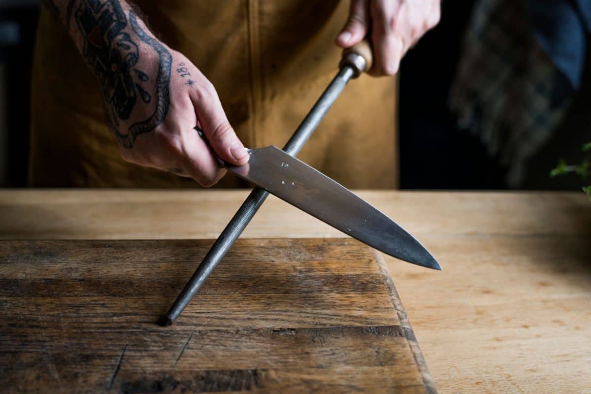 A butcher sharpening a knife