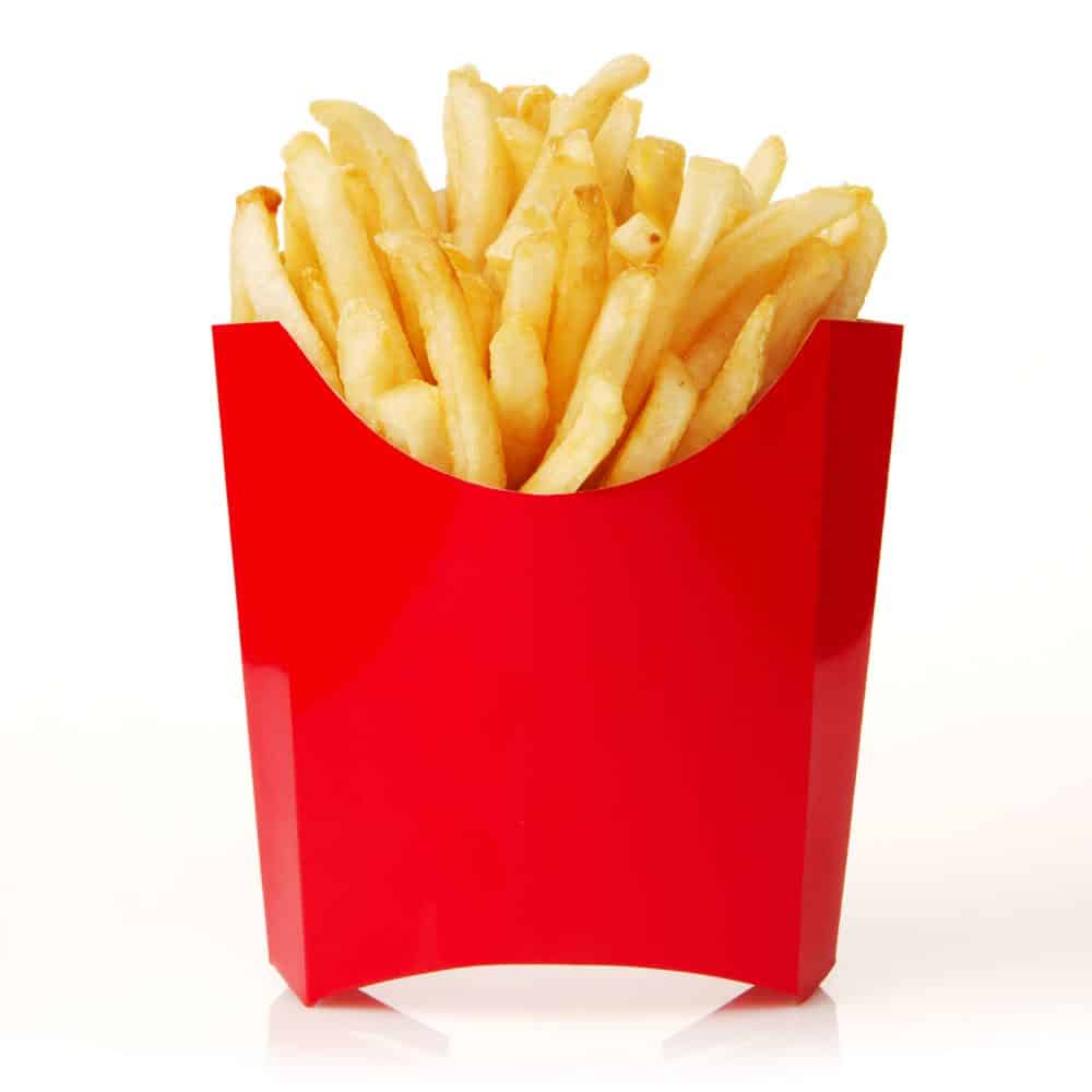 A red paper container with french fries on a white background