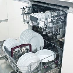 An opened dishwasher with lots of kitchen utensil inside, Can Ninja Foodi Lid Go In The Dishwasher?
