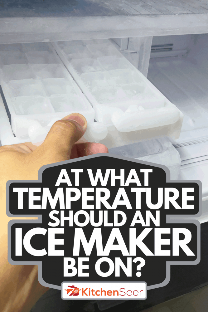 A man hand holding ice maker in new refrigerator, At What Temperature Should An Ice Maker Be On?