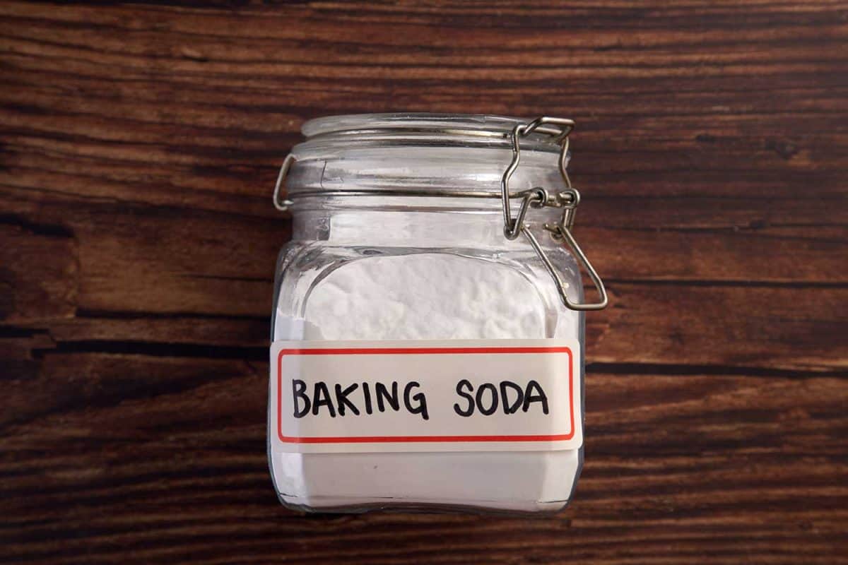 Baking soda on the wooden background