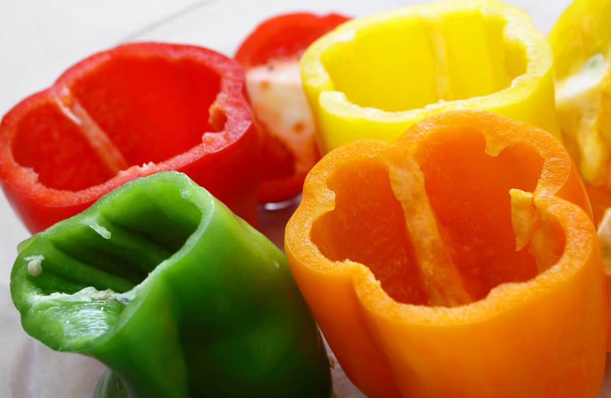 Bowl of peppers tops cut off