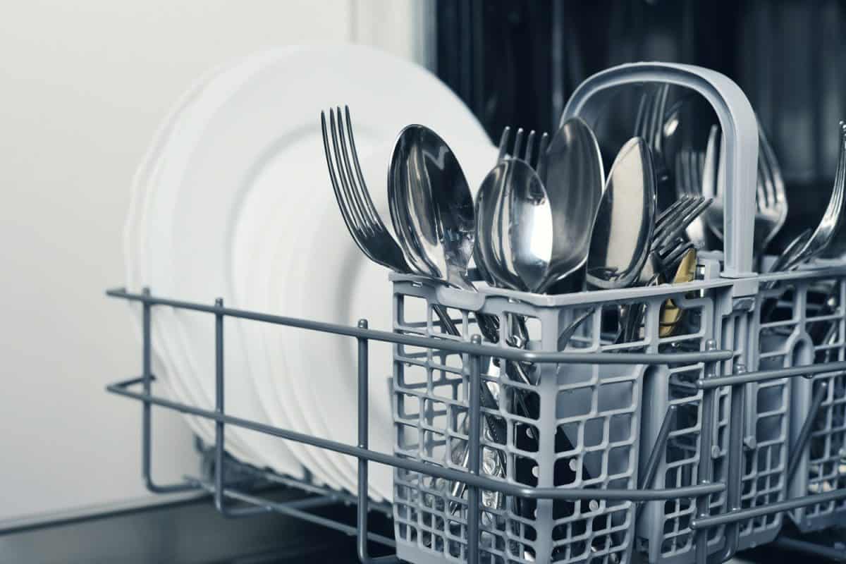 Clean cutlery and plates after washing in dishwasher machine