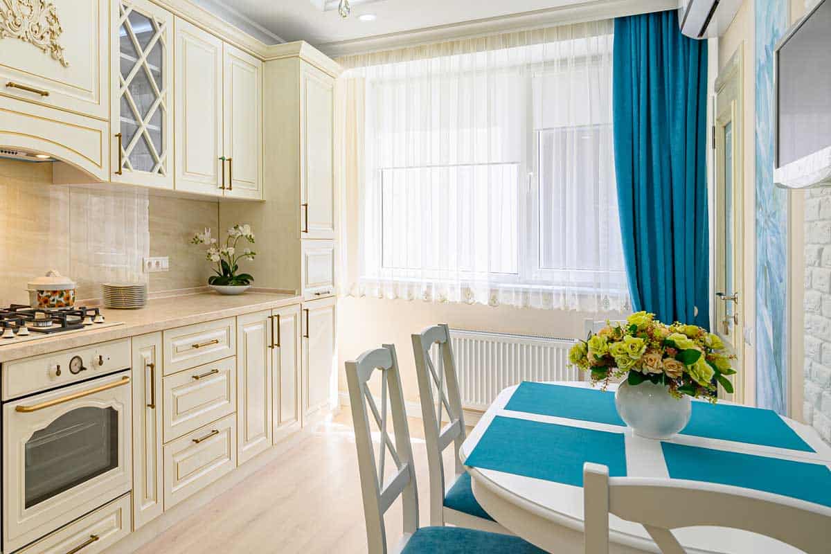 A contemporary classic kitchen interior designed in provence style, 8 Types Of Kitchen Curtains To Know