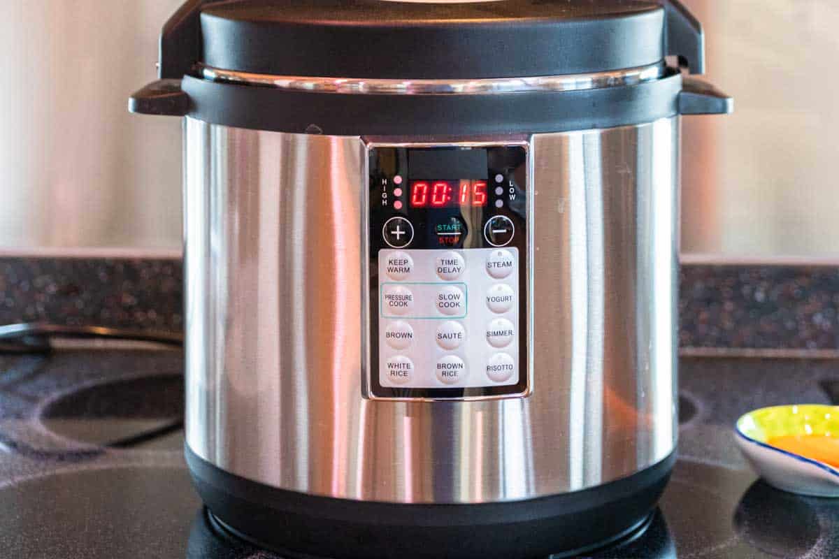 Cooking dinner in a pressure cooker in a modern kitchen,