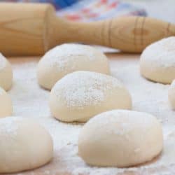 Cooking dough for pastries with a rolling pin on the back, How To Store Bread Dough Overnight [A Complete Guide]