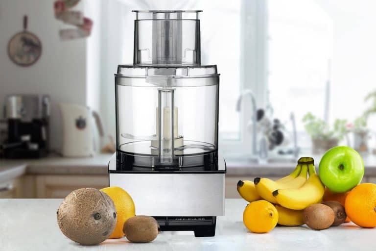 Food processor on top of the table with fruits, Does The Cuisinart Food Processor Julienne, Spiralize, And Puree?