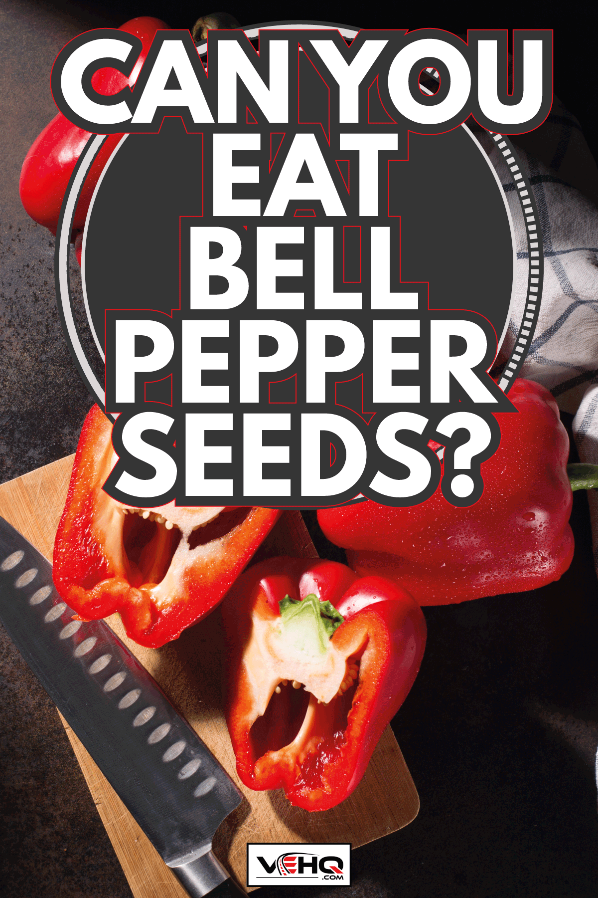 Fresh sweet red peppers and textile white blue towel on dark rustic wooden background. Can You Eat Bell Pepper Seeds
