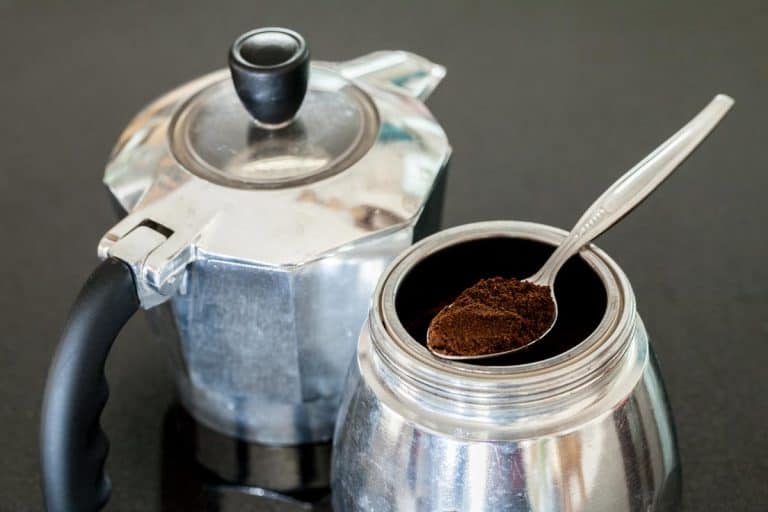 Grinded coffee on spoon in Italia coffee maker, How To Keep Coffee Grounds Out Of A Percolator