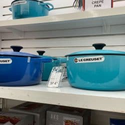 Le Creuset cooking pots for sale at a store, Can Le Creuset Go In The Microwave?