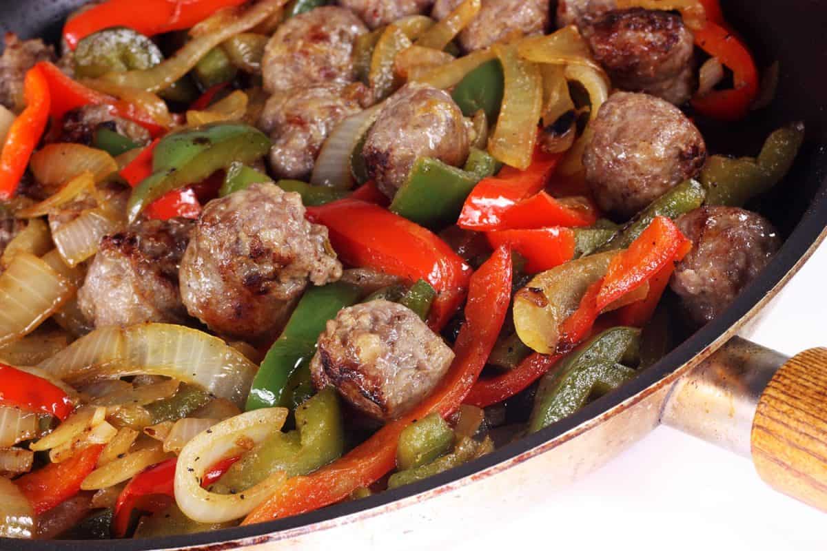 Meal with beef, sausage, onions and peppers