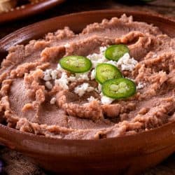 Mexican style refried beans with queso fresco and jalpeno pepper garnish, How To Properly Store Refried Beans