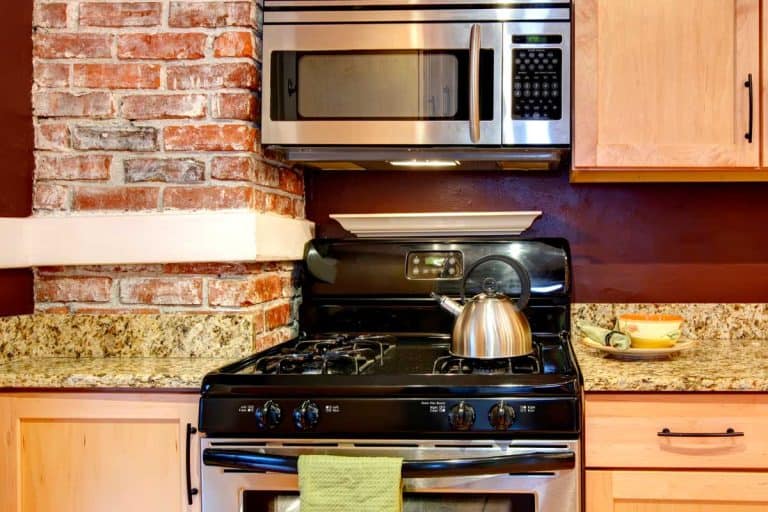 Modern appliances combined with burgundy backsplash and brick column, How To Remove An Over The Range Microwave