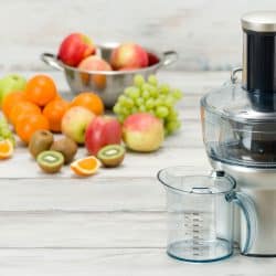 Modern electric juicer and various fruit on kitchen counter, healthy lifestyle concept, Cuisinart Food Processor Not Working - What To Do?