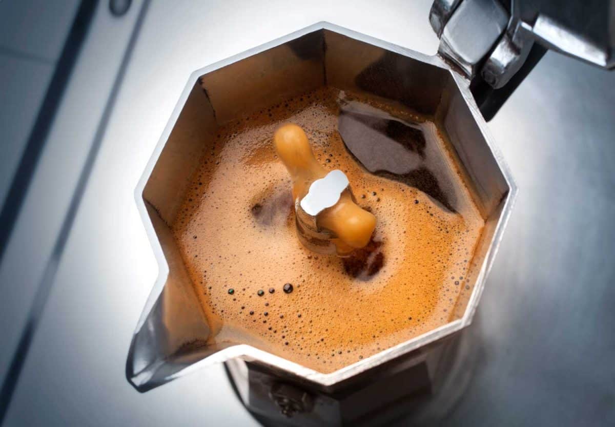 Moka with coffee on the stove top traditional Italian coffee maker
