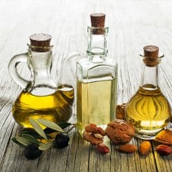 Olive, walnut and almond oil on wooden background, Can You Freeze Frying Oil?