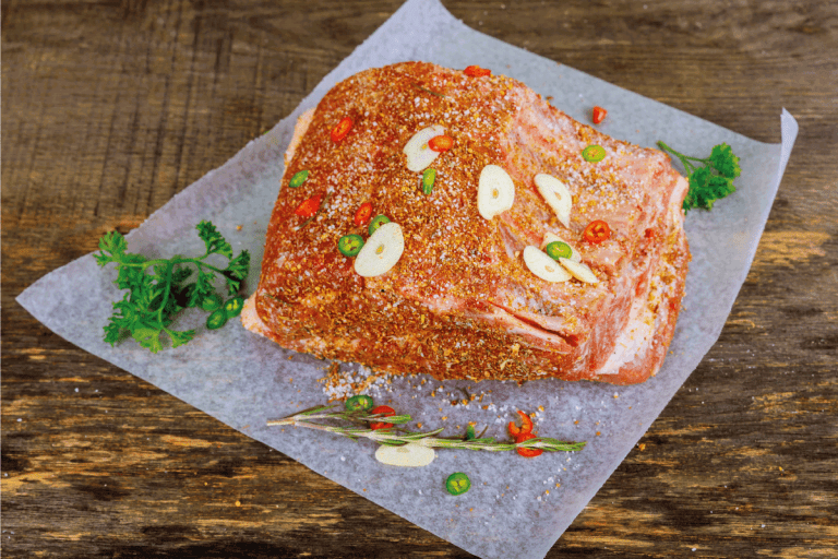 Raw veal ribs with spices on parchment paper. Can You Use Aluminum Foil Or Parchment Paper In Cuisinart Air Fryer