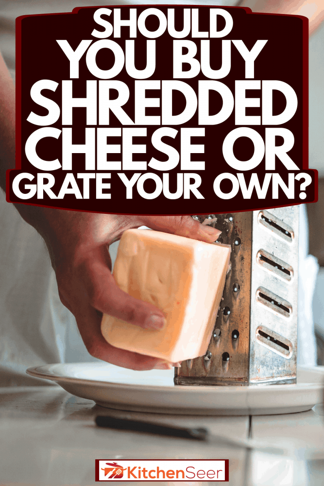 A woman grating cheese inside her kitchen for the spaghetti, Should You Buy Shredded Cheese Or Grate Your Own?