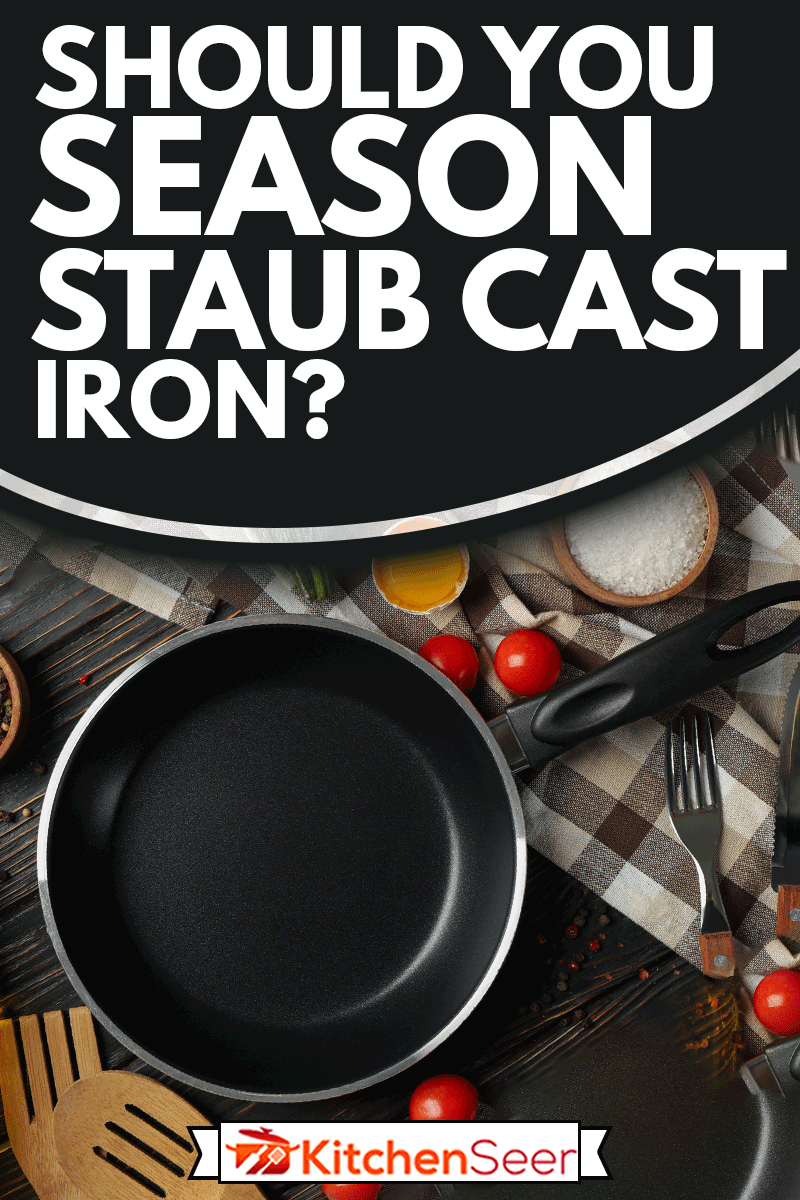 Composition with ingredients for cooking on wooden background with cast iron pan, Should You Season Staub Cast Iron?