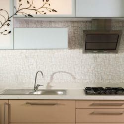 Square patterned kitchen backsplash beige cabinet drawers and a small cooktop and range hood, 21 Best Wallpaper Ideas For Kitchen Walls
