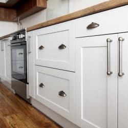 Stylish light gray handles on cabinets, Do Kitchen Cabinets Need Handles? [Inc. Handleless Options]