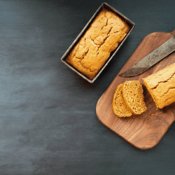 Two freshly baked homemade pumpkin bread loaves with knife over dark background. Image shot from top view, flatlay.Can You Bake A Cake In A Loaf Pan