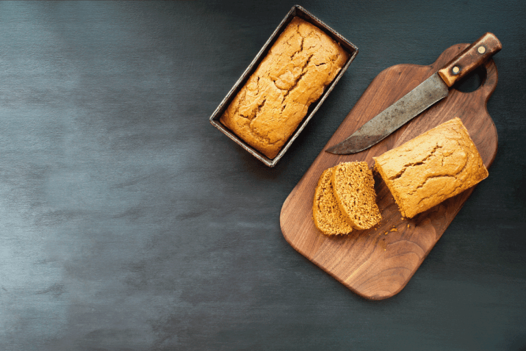 Two freshly baked homemade pumpkin bread loaves with knife over dark background. Image shot from top view, flatlay.Can You Bake A Cake In A Loaf Pan